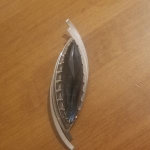 Grey and silver brooch